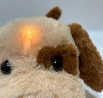 Perrito de peluche con función de luz y música